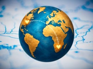 A globe with two hearts lit up in different countries